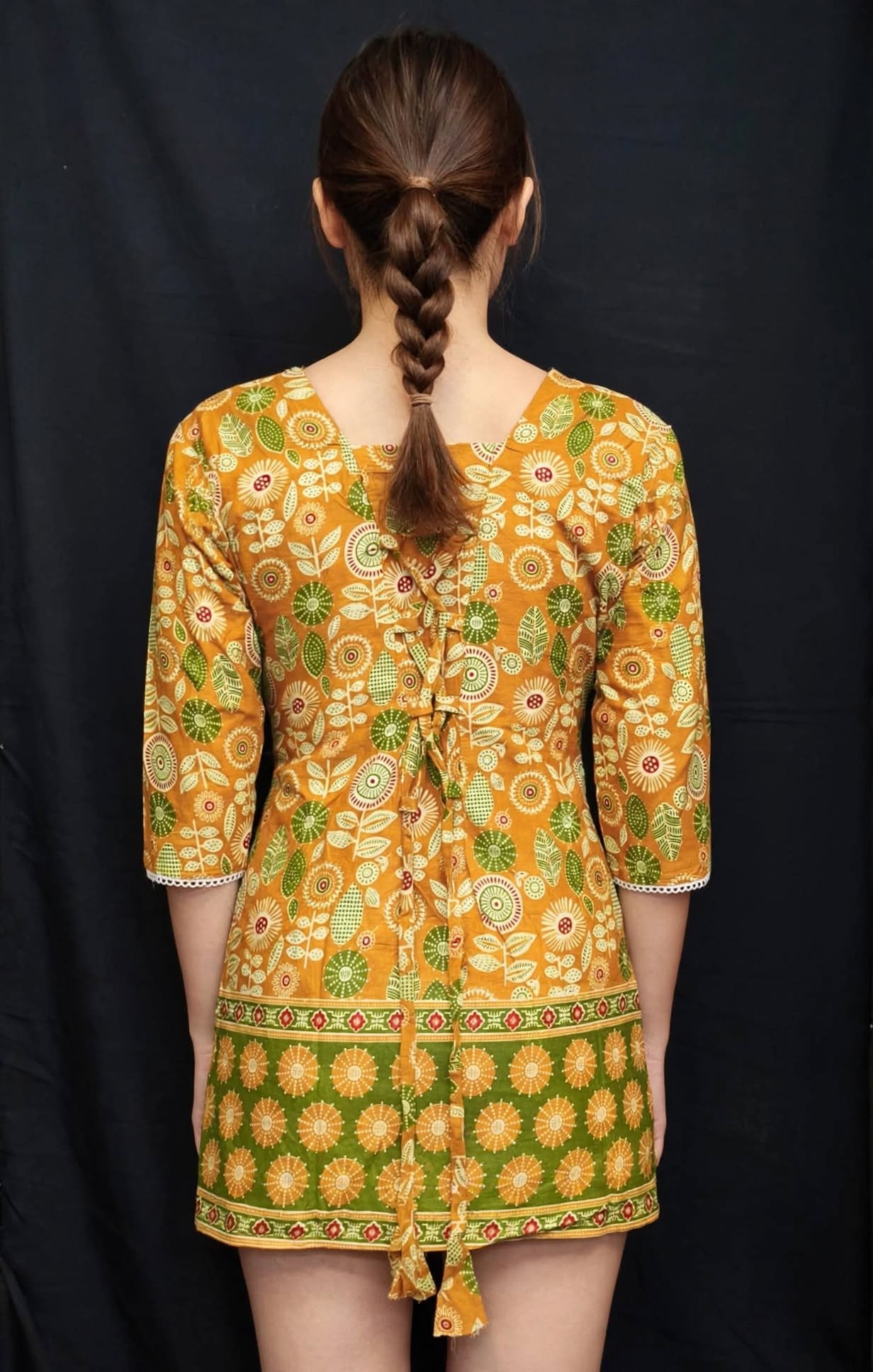 Mustard Yellow Floral Printed Cotton Short Kurti with Green Border & Lace Work - Image 2